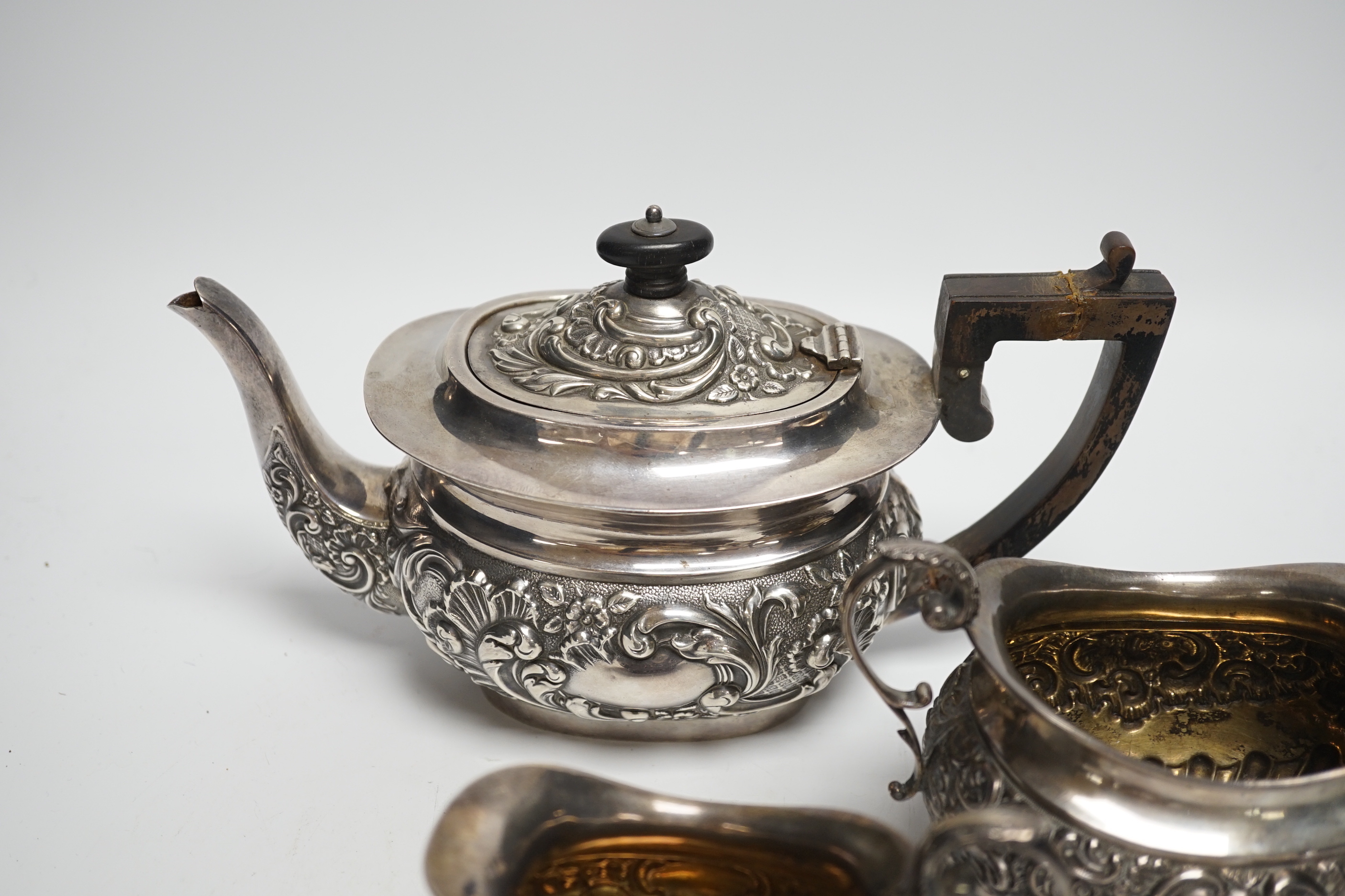 A matched late Victorian silver three piece tea set, maker's Haseler Brothers and John Round & Son Ltd, Birmingham, 1899 and Sheffield, 1900, gross weight 19.3oz.